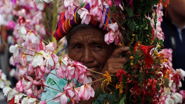 A woman takes part in a procession during the celebration of the Palms and Flowers Festival in Panchimalco, El Salvador. The residents of Pabchimalco celebrate the yearly festival at the beginning of the rainy season to ask for a good harvest. (Jose Cabezas / Reuters) A woman takes part in a procession during the celebration of the Palms and Flowers Festival in Panchimalco, El Salvador. The residents of Pabchimalco celebrate the yearly festival at the beginning of the rainy season to ask for a good harvest. (Jose Cabezas / Reuters)
