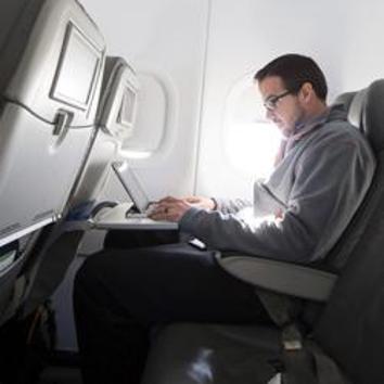 A man uses his laptop to test a new high speed inflight Internet service named Fli-Fi while on a special JetBlue media flight out of John F Kennedy International Airport in New York in this December 11, 2013 file picture. (Reuters File Photo) A man uses his laptop to test a new high speed inflight Internet service named Fli-Fi while on a special JetBlue media flight out of John F Kennedy International Airport in New York in this December 11, 2013 file picture. (Reuters File Photo)