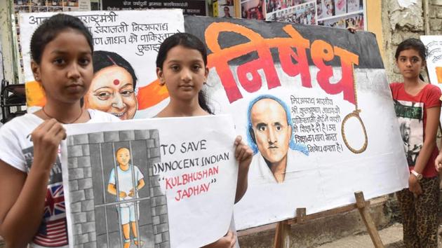 Girls in Mumbai display a painting of former Indian naval officer Kulbhushan Jadhav who has been sentenced to death by a Pakistani military court on charges of espionage. (PTI) Girls in Mumbai display a painting of former Indian naval officer Kulbhushan Jadhav who has been sentenced to death by a Pakistani military court on charges of espionage. (PTI)