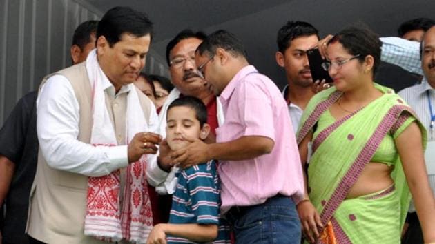 Assam Chief Minister Sarbananda Sonowal (L) distributes free aids and assistive devices to specially abled people at Amguri in Sivasagar on Wednesday. (PTI Photo) Assam Chief Minister Sarbananda Sonowal (L) distributes free aids and assistive devices to specially abled people at Amguri in Sivasagar on Wednesday. (PTI Photo)