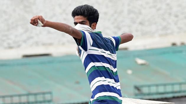A Kashmiri student throws a stone during clashes between Kashmiri students and government forces in Srinagar's Lal Chowk.(AFP) A Kashmiri student throws a stone during clashes between Kashmiri students and government forces in Srinagar's Lal Chowk.(AFP)