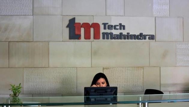 An employee at the front desk in the Tech Mahindra office in Noida near New Delhi. (REUTERS File) An employee at the front desk in the Tech Mahindra office in Noida near New Delhi. (REUTERS File)