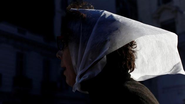 A member of the human rights organization Madres de Plaza de Mayo (Mothers of the disappeared) takes part in a demonstration. During the dictatorship years, they fought to recover their children and grandchildren by marching every week in front of the main square in Buenos Aires. (Martin Acosta/REUTERS)