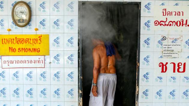 A patient enters a steam bath at the rehabilitation area. (Jorge Silva / Reuters) A patient enters a steam bath at the rehabilitation area. (Jorge Silva / Reuters)