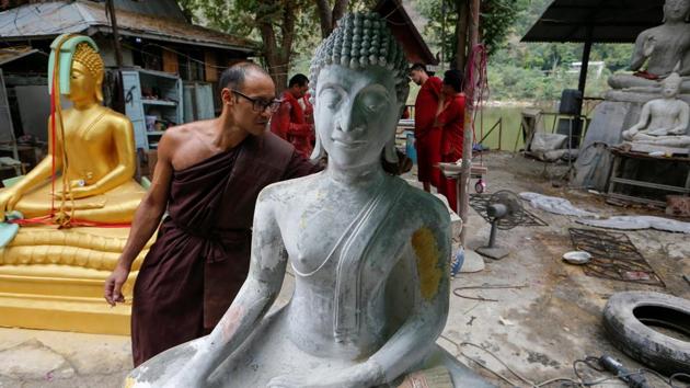 Jeremy, a Buddhist monk from Australia, inspects a Buddha statue at a workshop. Jeremy underwent treatment at the monastery three years ago for heroin addiction. (Jorge Silva / Reuters) Jeremy, a Buddhist monk from Australia, inspects a Buddha statue at a workshop. Jeremy underwent treatment at the monastery three years ago for heroin addiction. (Jorge Silva / Reuters)