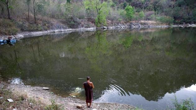 A Buddhist monk prays after throwing food to fish and turtles at a lake inside Wat Thamkrabok monastery. Some experts have questioned the effectiveness of Wat Thamkrabok’s methods. (Jorge Silva / Reuters) A Buddhist monk prays after throwing food to fish and turtles at a lake inside Wat Thamkrabok monastery. Some experts have questioned the effectiveness of Wat Thamkrabok’s methods. (Jorge Silva / Reuters)