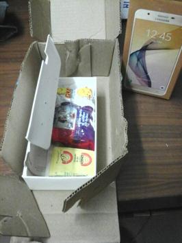 The packet containing a bar of soap and a packet of washing powder that was delivered to the complainant.(HT Photo)