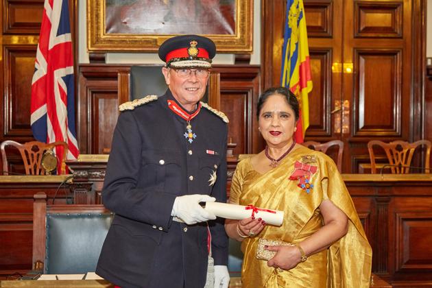 Asha Khemka being appointed deputy lieutenant by the lord-lieutenant of Staffordshire, Ian James Dudson. (HT Photo) Asha Khemka being appointed deputy lieutenant by the lord-lieutenant of Staffordshire, Ian James Dudson. (HT Photo)