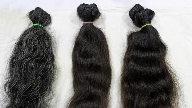 Donated hair is sorted carefully into ‘plaits’ based on length, colour and texture. Each plait is then brushed carefully to remove all knots. It is now ready to be rooted into a ‘cap’. (Satyabrata Tripathy / HT Photo)