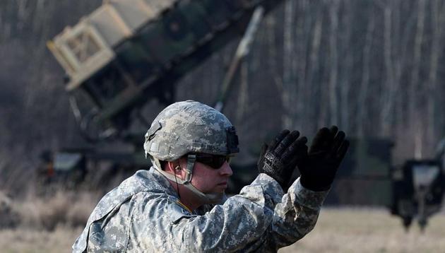 (FILES) This file photo taken on March 21, 2015 shows US troops from the 5th Battalion of the 7th Air Defense Regiment as they emplace a launching station of the Patriot air and missile defence system at a test range in Sochaczew, Poland. (AFP) (FILES) This file photo taken on March 21, 2015 shows US troops from the 5th Battalion of the 7th Air Defense Regiment as they emplace a launching station of the Patriot air and missile defence system at a test range in Sochaczew, Poland. (AFP)