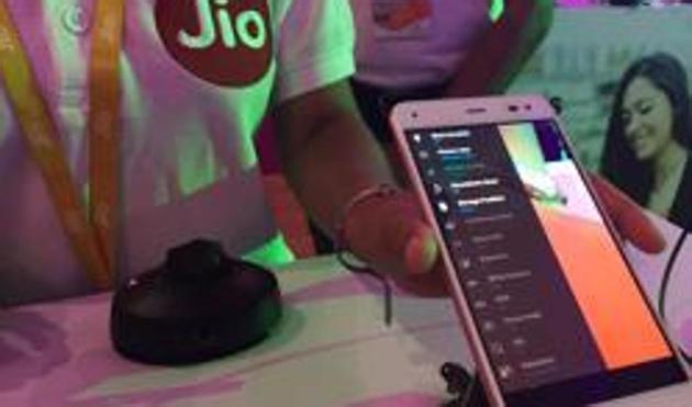 A Reliance employee demonstrates Jio LYF phone at their headquarters on the outskirts of Mumbai. (REUTERS) A Reliance employee demonstrates Jio LYF phone at their headquarters on the outskirts of Mumbai. (REUTERS)