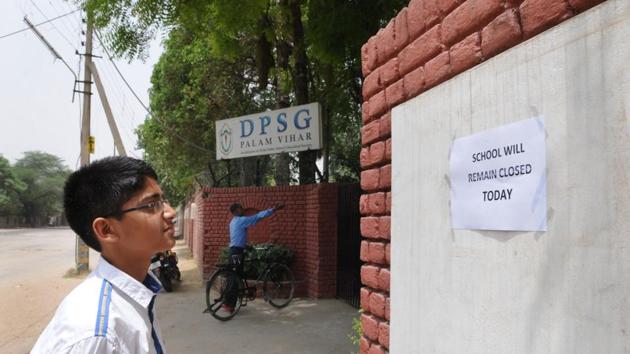 A student reads the notice put outside Delhi Public School Ghaziabad, Palam Vihar, regarding its indefinite closure.(Parveen Kumar/ HT Photo) A student reads the notice put outside Delhi Public School Ghaziabad, Palam Vihar, regarding its indefinite closure.(Parveen Kumar/ HT Photo)