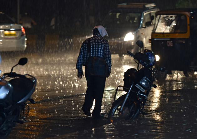 A man is caught unawares in the rain at Navi Mumbai. (Bachchan Kumar) A man is caught unawares in the rain at Navi Mumbai. (Bachchan Kumar)