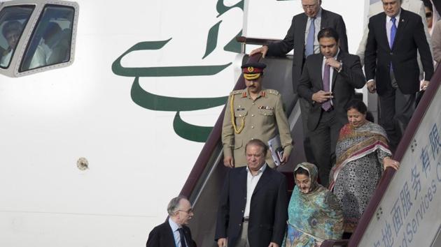 Pakistani Prime Minister Nawaz Sharif and his wife Kalsoom Nawaz Sharif arrive on a flight at Beijing's International Airport ahead of the Belt and Road Forum in Beijing Friday, May 12, 2017. (AP Photo/Ng Han Guan) (AP) Pakistani Prime Minister Nawaz Sharif and his wife Kalsoom Nawaz Sharif arrive on a flight at Beijing's International Airport ahead of the Belt and Road Forum in Beijing Friday, May 12, 2017. (AP Photo/Ng Han Guan) (AP)