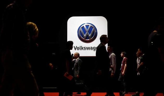 People pass in front of a Volkswagen logo at Shanghai Auto Show during its media day, in Shanghai. (Reuters file photo) People pass in front of a Volkswagen logo at Shanghai Auto Show during its media day, in Shanghai. (Reuters file photo)