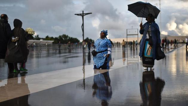 An Angolan woman pays a promise walking on her knees at Fatima Sanctuary. The Virgin is said to have appeared six times in Fatima, north of Lisbon, between May and October 1917 to three impoverished, barely-literate children -- Jacinta, 7, Francisco, 9, and their cousin Lucia, 10. (Patricia De Melo Moreira/AFP)