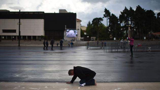 On Saturday, the 100th anniversary of the first reported apparition, Pope Francis will canonise Jacinta and Francisco, who have officially been found responsible for two miracles. (Patricia De Melo Moreira/AFP)