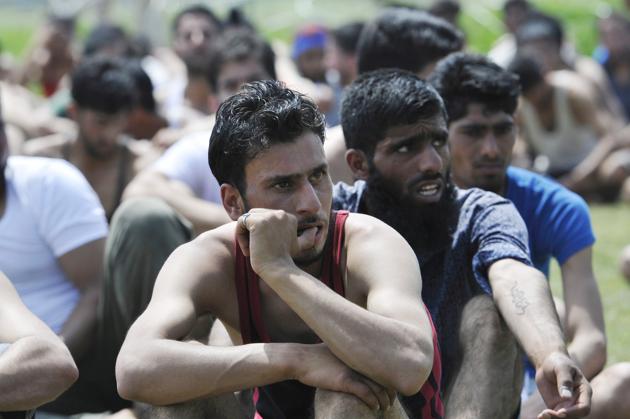 Kashmiri youth wait in anticipation for their turn to give physical fitness tests during a police recruitment rally on May 12, 2017 in Anantnag, South Kashmir. On the first day of the rally yesterday, 1674 candidates participated in Anantnag, while 1295 turned up in Bandipora in an overwhelming response to the recruitment drive. (Waseem Andrabi/ht photo) Kashmiri youth wait in anticipation for their turn to give physical fitness tests during a police recruitment rally on May 12, 2017 in Anantnag, South Kashmir. On the first day of the rally yesterday, 1674 candidates participated in Anantnag, while 1295 turned up in Bandipora in an overwhelming response to the recruitment drive. (Waseem Andrabi/ht photo)