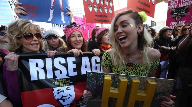 Jane Fonda and singer Miley Cyrus march during the Women's March on January 21, 2017 in Los Angeles, California. (AFP) Jane Fonda and singer Miley Cyrus march during the Women's March on January 21, 2017 in Los Angeles, California. (AFP)