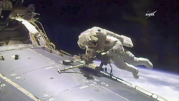 In this image made from video provided by NASA, astronaut Jack Fischer works outside the International Space Station on Friday, May 12, 2017. Fischer and Peggy Whitson, not pictured, performed the station's 200th spacewalk.(AP Photo)