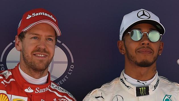 Lewis Hamilton (R) grabbed the pole position in his Mercedes ahead of Ferrari rival Sebastian Vetter (L) at the Spanish Grand Prix in Barcelona on Saturday.(AFP)