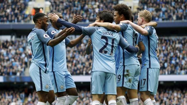 Manchester City's David Silva (centre) celebrates scoring during the Premier League match against Leicester City. (AP) Manchester City's David Silva (centre) celebrates scoring during the Premier League match against Leicester City. (AP)