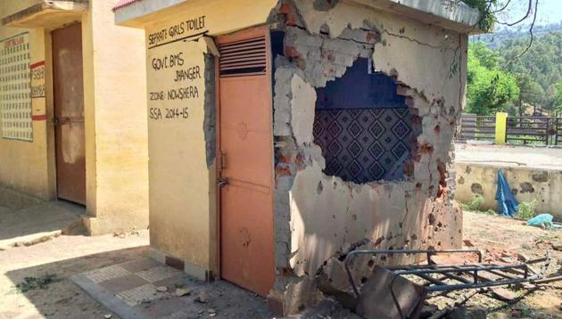 The damaged wall of a government school, which was hit by mortal shells in Nowshera sector of Rajouri district on Thursday. (PTI photo) The damaged wall of a government school, which was hit by mortal shells in Nowshera sector of Rajouri district on Thursday. (PTI photo)