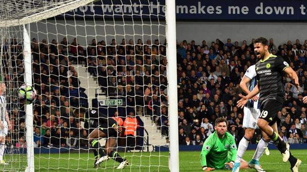 Chelsea's Diego Costa (R) celebrates as Michy Batshuayi (L) scores the goal past West Bromwich Albion's goalkeeper Ben Foster (2R) to seal the match and the Premier League title on Friday. (AFP)