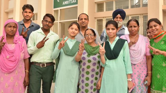 Students and parents in jubilant mood after the declaration of the Class 12 results of PSEB, in Amritsar. (Sameer Sehgal/HT)