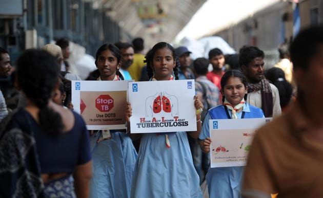 Schoolchildren hold placards as they participate in a tuberculosis awareness campaign at a railway station in Chennai on World Tuberculosis Day. In India, undernutrition contributes to a staggering 55% of the annual TB incidence.(AFP)