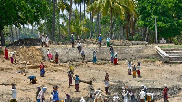With the south-west monsoon expected soon,the labourers are worried about completing the task assigned on time. (Arijit Sen/HT Photo)