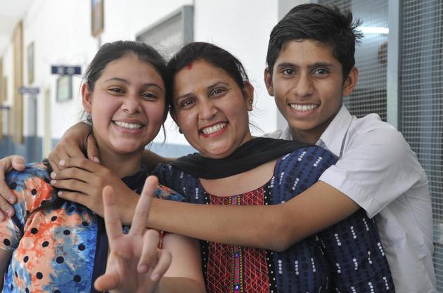 Ludhiana’s Divya with her mother and brother in Ludhiana on Saturday. (Gurminder Singh/HT)