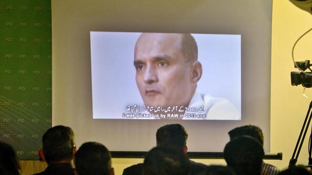 In this March 29, 2016 photo, journalists look a image of Indian naval officer Kulbhushan Jadhav, who was arrested in March 2016, during a press conference by Pakistan's army spokesman and the Information Minister, in Islamabad, Pakistan.(AP)