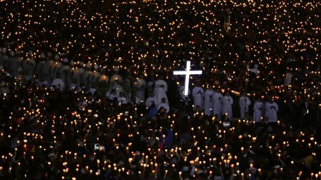 Pilgrims attend a candlelight vigil at the Catholic shrine of Fatima, Portugal. (Pedro Nunes / REUTERS)