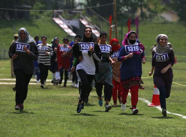 Girls run to qualify the test during the recruitment rally. Girls run to qualify the test during the recruitment rally.