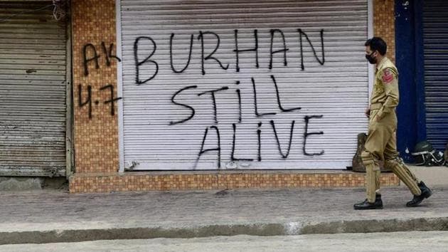 A policeman patrols the streets days after Hizbul militant commander Burhan Wani was killed in July 2016. Militant leader Zakir Musa is believed to have been heading the group’s operations in Kashmir after Wani’s death.(PTI File Photo)