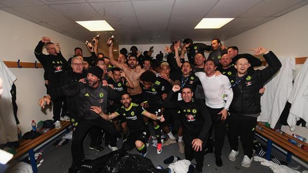 The party was just beginning and the celebrations spilled into the Chelsea dressing room, where bubbly stuff started flowing. (Chelsea FC via Getty Images)