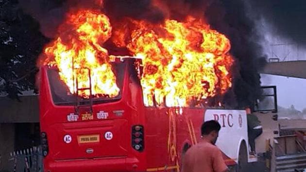 The bus on fire in Rampura Phul near Bathinda on Saturday, May 13.(Sanjeev Kumar/HT)