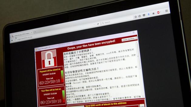 A screenshot of the warning screen from a purported ransomware attack, as captured by a computer user in Taiwan, is seen on laptop in Beijing on Saturday. Dozens of countries were hit with a huge cyberextortion attack Friday that locked up computers and held users' files for ransom at a multitude of hospitals, companies and government agencies. (AP Photo) A screenshot of the warning screen from a purported ransomware attack, as captured by a computer user in Taiwan, is seen on laptop in Beijing on Saturday. Dozens of countries were hit with a huge cyberextortion attack Friday that locked up computers and held users' files for ransom at a multitude of hospitals, companies and government agencies. (AP Photo)