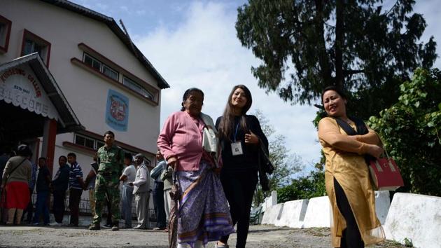 An elderly voter is assisted by volunteers after casting her vote at a polling station in Kurseong on Sunday for local municipal elections. (AFP) An elderly voter is assisted by volunteers after casting her vote at a polling station in Kurseong on Sunday for local municipal elections. (AFP)