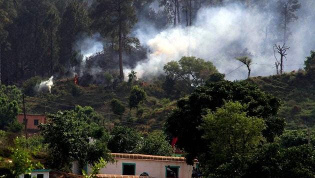 Smoke billows out after shelling by Pakistani army along the Line of Control (LoC) in Rajouri district of Jammu and Kashmir. (PTI) Smoke billows out after shelling by Pakistani army along the Line of Control (LoC) in Rajouri district of Jammu and Kashmir. (PTI)