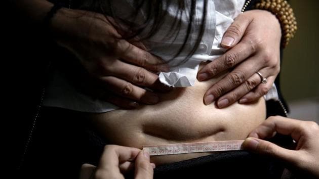 Wang Ruoyu, 37, mother of a 16-year-old son and yoga coach, has her caesarean delivery (C-section) scar measured for a tattoo design, at Samurai Tattoo in Shanghai, China. Ruoyu had a caesarean delivery because her baby weighed 4.25 kilograms at birth. She began practising yoga for postpartum recovery and became a yoga coach. ‘I love all beautiful things that make me look better," she said, "I chose the pattern of a crown with wings to cover the scar. It looks nice.’ (Aly Song / Reuters) Wang Ruoyu, 37, mother of a 16-year-old son and yoga coach, has her caesarean delivery (C-section) scar measured for a tattoo design, at Samurai Tattoo in Shanghai, China. Ruoyu had a caesarean delivery because her baby weighed 4.25 kilograms at birth. She began practising yoga for postpartum recovery and became a yoga coach. ‘I love all beautiful things that make me look better," she said, "I chose the pattern of a crown with wings to cover the scar. It looks nice.’ (Aly Song / Reuters)