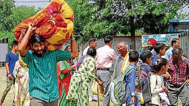 People who have taken shelter in relief camps say they are living like refugees. (PTI Photo) People who have taken shelter in relief camps say they are living like refugees. (PTI Photo)