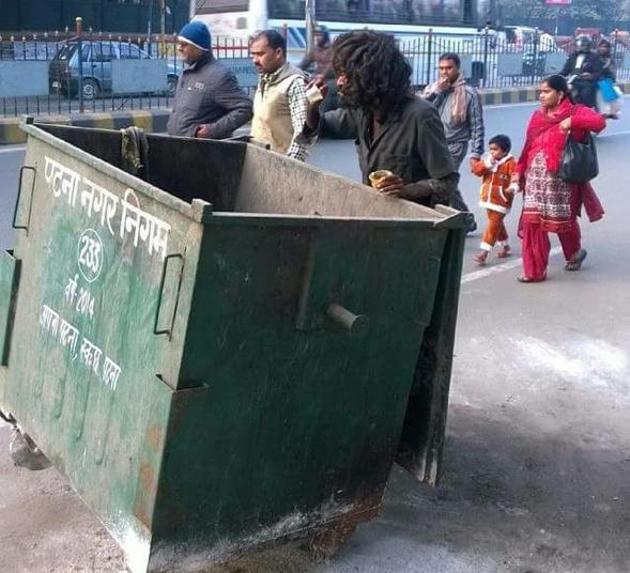 A man searches for leftover food from a garbage bin in Patna. (File photo) A man searches for leftover food from a garbage bin in Patna. (File photo)