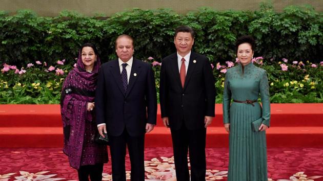 Pakistan's Prime Minister Nawaz Sharif (2ndL) and his wife Kalsoom Nawaz Sharif (L) pose with Chinese President Xi Jinping and his wife Peng Liyuan (R) during a welcome ceremony for leaders attending the Belt and Road Forum, in Beijing's Great Hall of the People on Sunday. (AFP Photo) Pakistan's Prime Minister Nawaz Sharif (2ndL) and his wife Kalsoom Nawaz Sharif (L) pose with Chinese President Xi Jinping and his wife Peng Liyuan (R) during a welcome ceremony for leaders attending the Belt and Road Forum, in Beijing's Great Hall of the People on Sunday. (AFP Photo)
