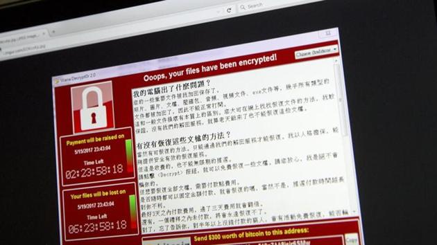 A screenshot of the warning screen from a purported ransomware attack, as captured by a computer user in Taiwan, is seen on laptop in Beijing, Saturday, May 13, 2017. (AP) A screenshot of the warning screen from a purported ransomware attack, as captured by a computer user in Taiwan, is seen on laptop in Beijing, Saturday, May 13, 2017. (AP)