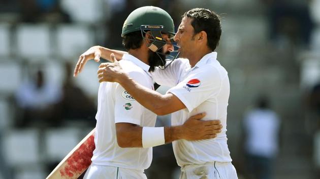 Younis Khan consoles Misbah-ul-Haq (L) after the outgoing skipper was dismissed for 2 runs in his final innings, during the third Test against West Indies cricket team at the Windsor Park Stadium in Roseau, Dominica. (AFP) Younis Khan consoles Misbah-ul-Haq (L) after the outgoing skipper was dismissed for 2 runs in his final innings, during the third Test against West Indies cricket team at the Windsor Park Stadium in Roseau, Dominica. (AFP)