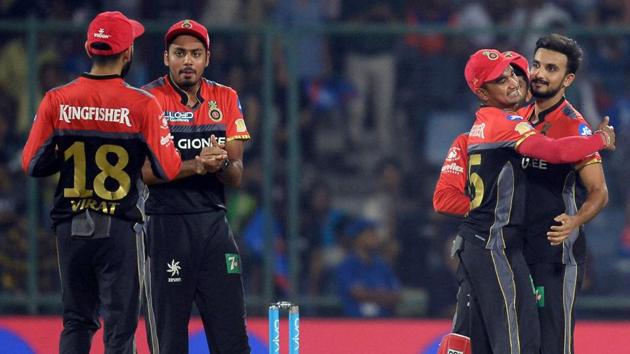 Royal Challengers Bangalore bowler Harshal Patel (R) celebrates with teammates after taking the wicket of Delhi Daredevils batsman Rishab Pant (not in picture) during their 2017 Indian Premier League match on Sunday. (AFP) Royal Challengers Bangalore bowler Harshal Patel (R) celebrates with teammates after taking the wicket of Delhi Daredevils batsman Rishab Pant (not in picture) during their 2017 Indian Premier League match on Sunday. (AFP)