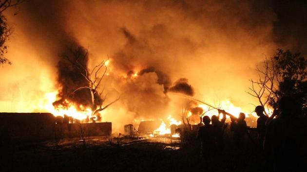 The raging fire at a paint manufacturing unit in Kavi Nagar could be seen several kilometres away and could not be controlled fully, despite the Ghaziabad officials roping in their temporary foam firefighting team and 20 fire tenders to battle the blaze. (Sakib Ali /HT Photo) The raging fire at a paint manufacturing unit in Kavi Nagar could be seen several kilometres away and could not be controlled fully, despite the Ghaziabad officials roping in their temporary foam firefighting team and 20 fire tenders to battle the blaze. (Sakib Ali /HT Photo)
