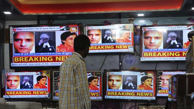 Television channels show news about the ICJ hearing on Kulbhushan Jadhav’s death sentence. (AP Photo)